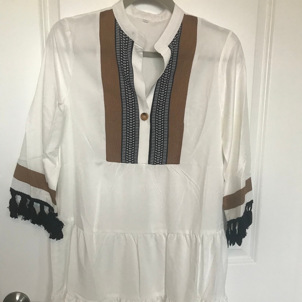 White shift dress with tassels on sleeve
